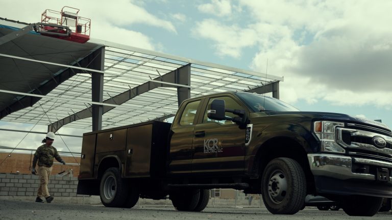 A KCR Electric LLC logo on a black truck